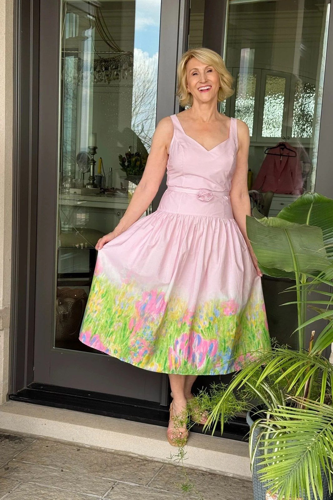 Pink floral skater summer dress for older women twirling