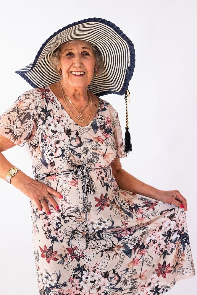 Floral midi summer dress for older women with wide sunhat
