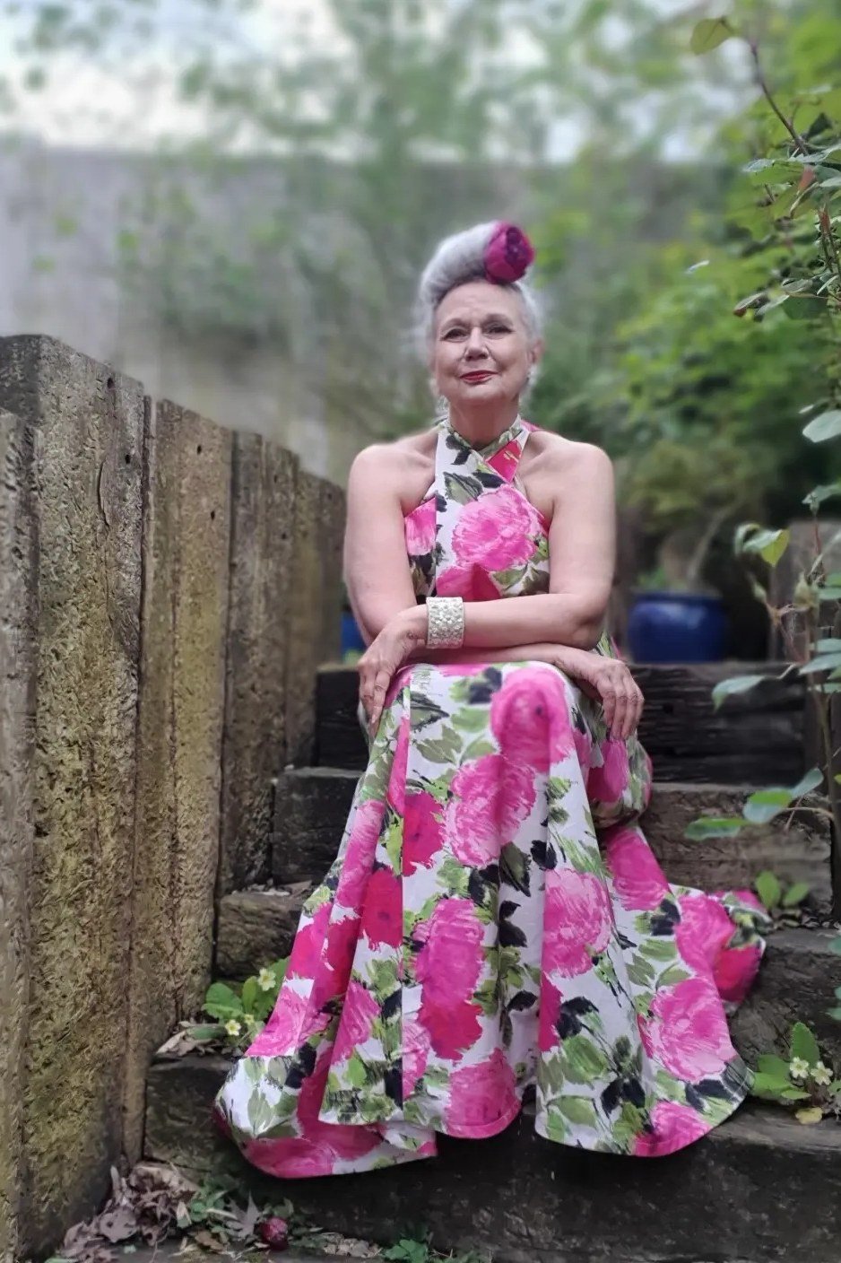 Pink floral halter maxi summer dress for older women seated