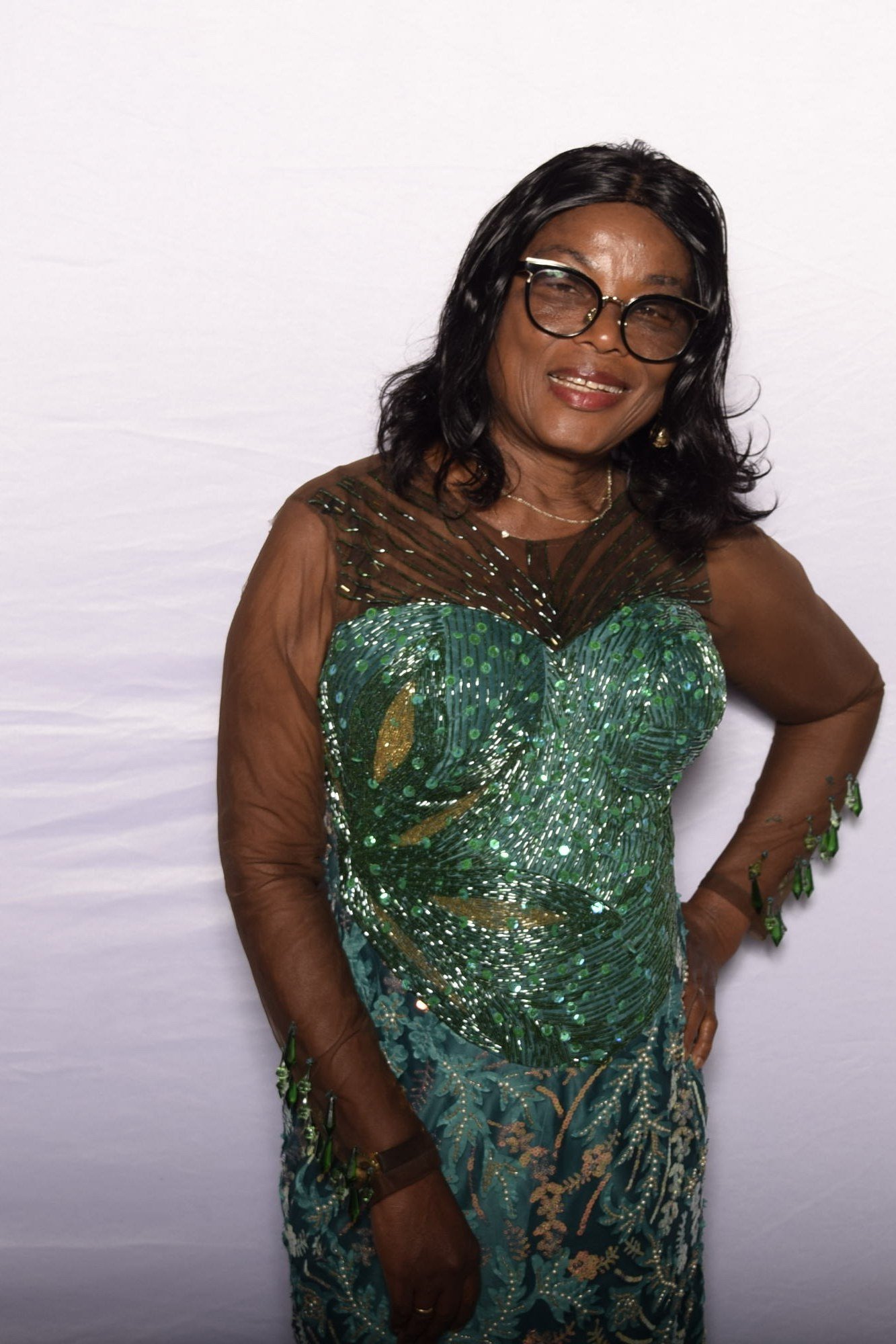 emerald sequin gown with sheer illusion neckline, evening outfit for women over 50