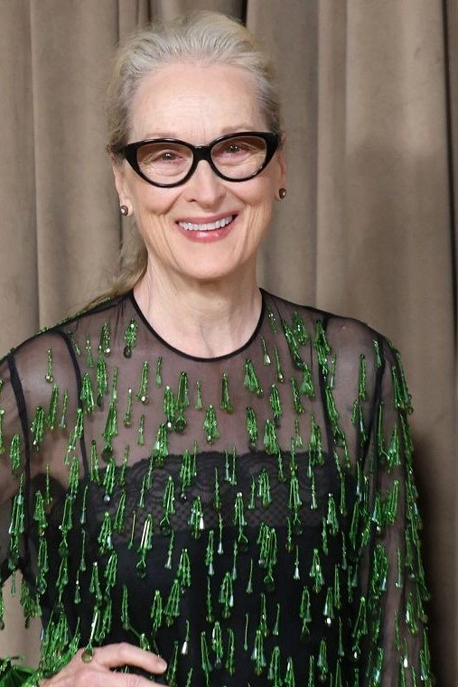 black dress with green sequin fringe overlay, evening outfit for women over 50