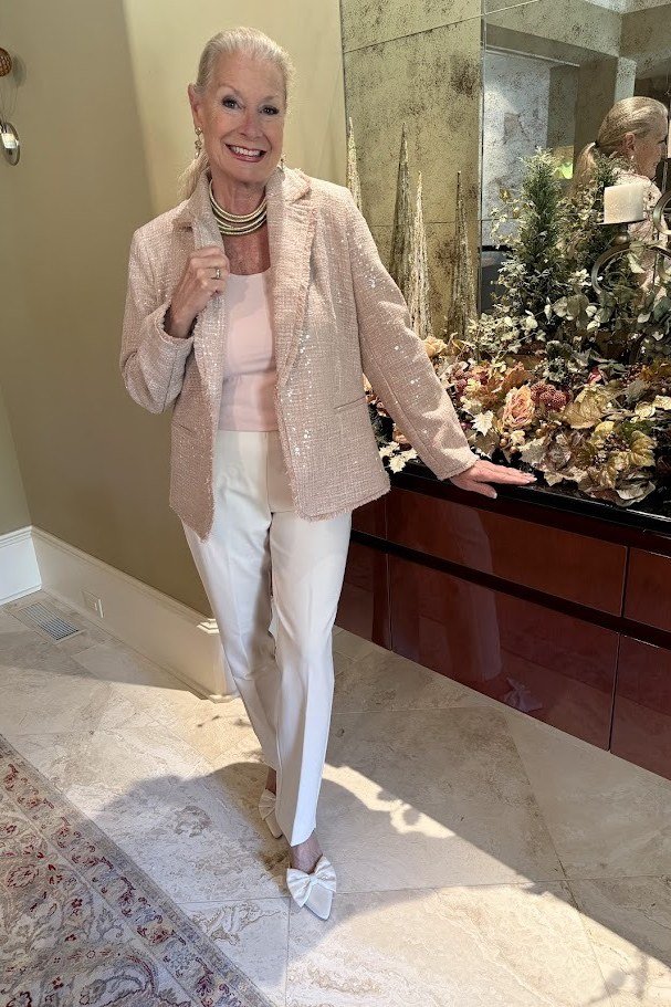 blush pink sequin jacket with white trousers, evening outfit for women over 50