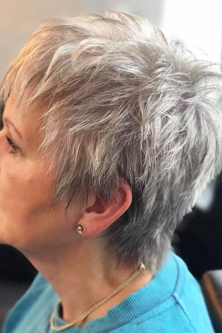 12. Side-Swept Silver Pixie with Volume - short haircut for women over 70 with thin hair