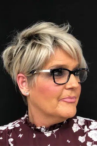 62. Blonde Pixie with a Bright Smile - short haircut for women over 70 with thin hair