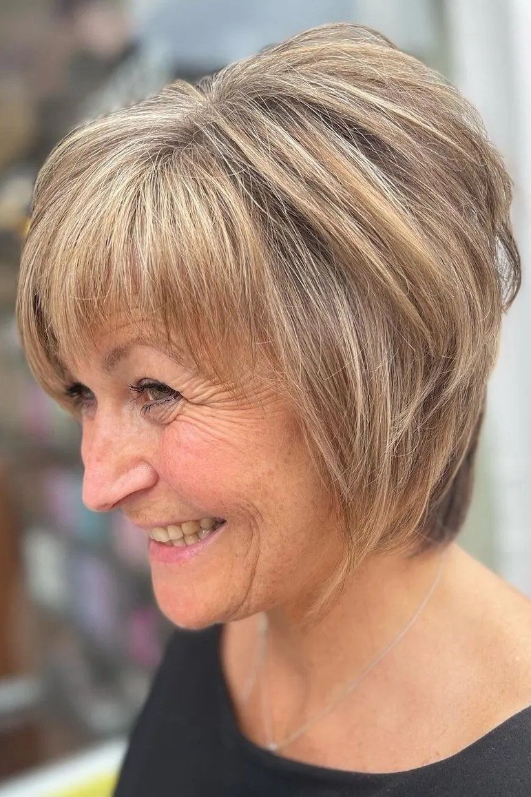 Smiling Blonde Layered Shaggy Bob - shaggy bob hairstyle for fine hair, women over 60