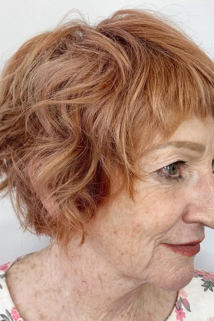 55. Copper Wavy Bob - tousled shaggy bob hairstyle for women over 60