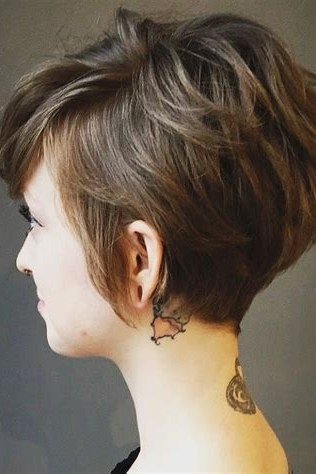 Shaggy pixie bob hairstyle for women over 60: grey shaggy pixie bob, choppy pieces, younger woman, side view