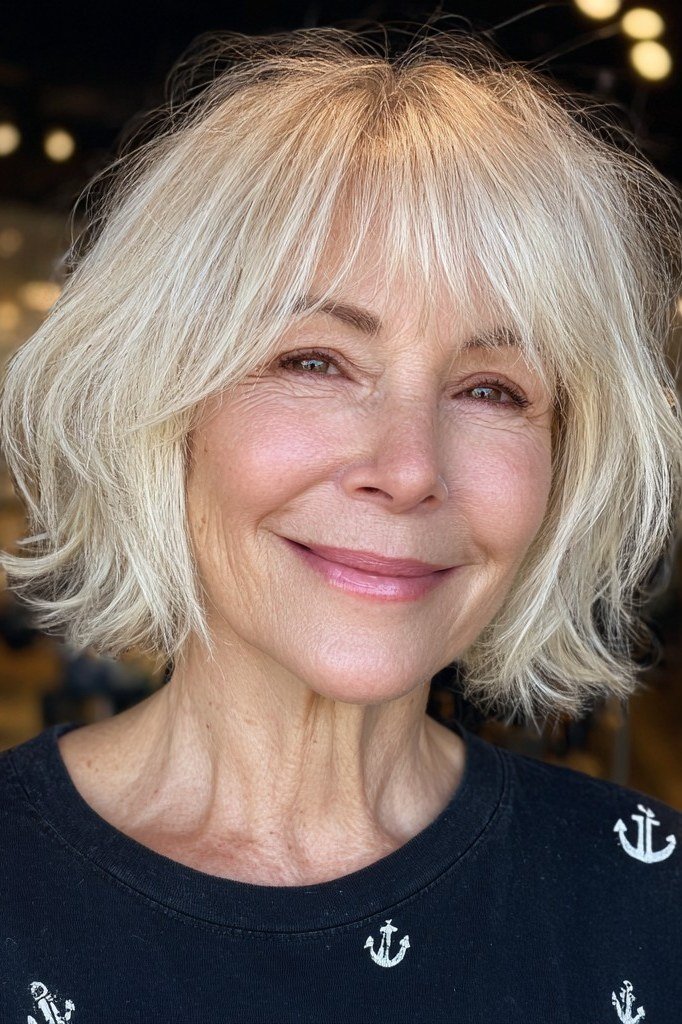 Radiant white shaggy bob haircut for women over 60, front view