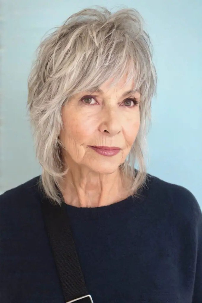 Silver white shaggy bob with bangs for thin hair over 60, front view