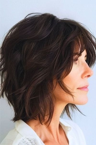 Dark shaggy bob, side profile - shaggy haircut for women over 50 with fine hair