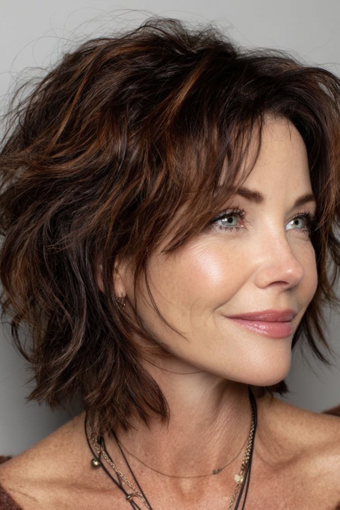 Brunette tousled shag, front - shaggy haircut for women over 50 with fine hair