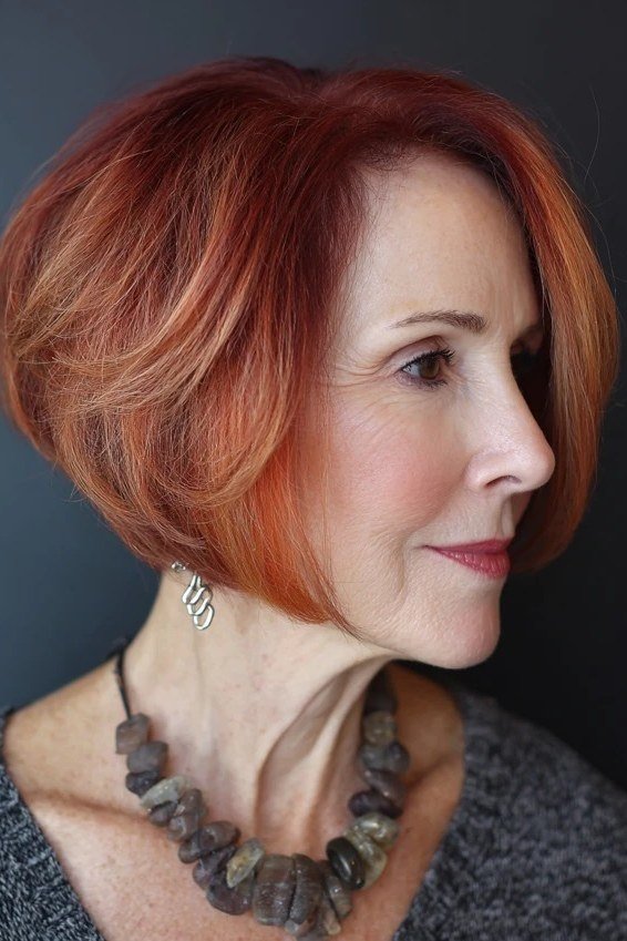 Copper rounded bob, side view - shaggy haircut for women over 50 with fine hair