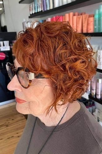 Copper curly shag, side view, salon - shaggy haircut for women over 50 with fine hair