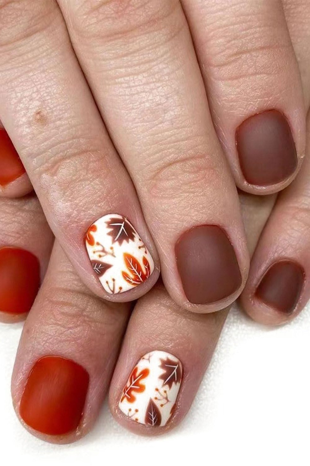 Matte Cocoa and Terracotta with Marble Leaf Art, classy short fall nails for women over 50