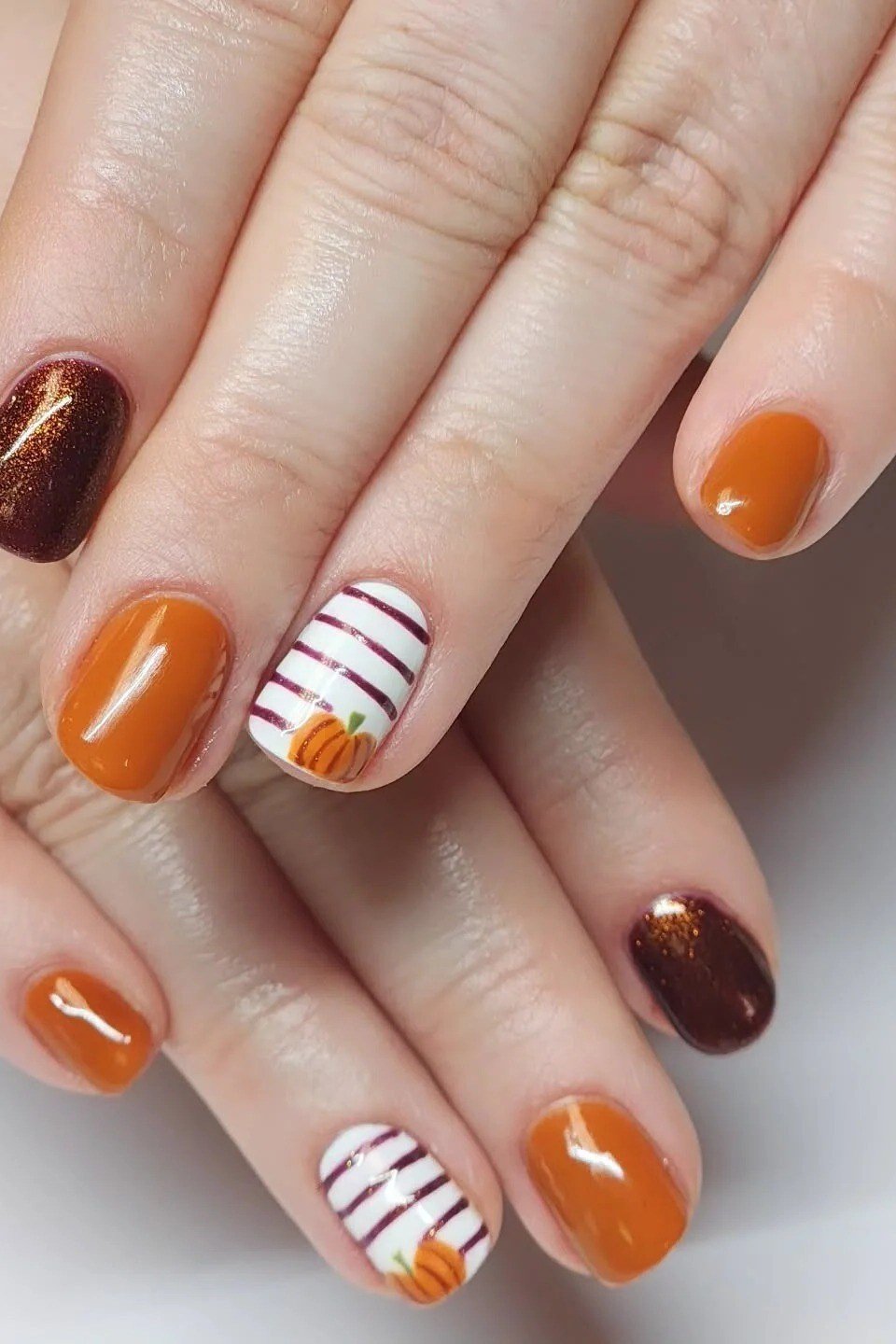Burnt Orange with Copper Stripe Art, classy short fall nails for women over 50