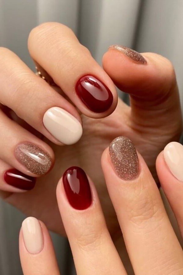 Burgundy Red and Nude with Glitter, classy short fall nails for women over 50