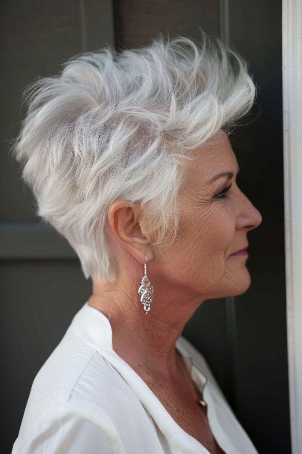 Spiky white pixie haircut with texture, side view