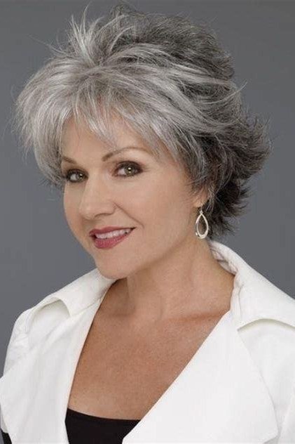 Salt-and-pepper textured pixie haircut for women over 60