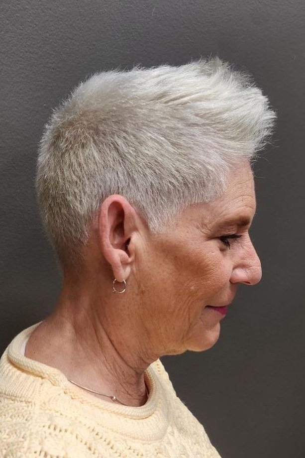 Super-short sleek silver pixie haircut, side profile