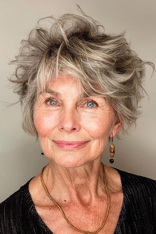 Gray curly pixie haircut with defined ringlets for older women
