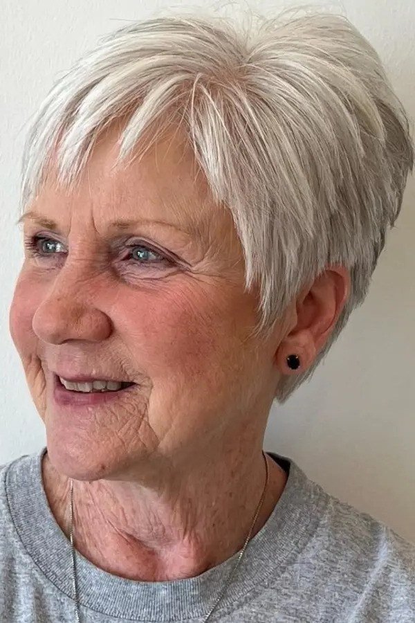 Bright White Pixie with Soft Bangs on a woman over 70