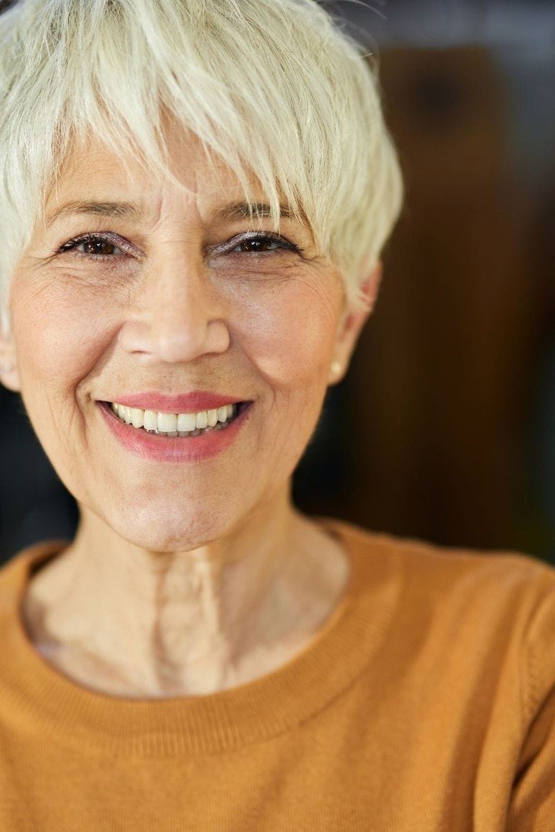 Soft White Pixie with Gentle Layers on a woman over 70