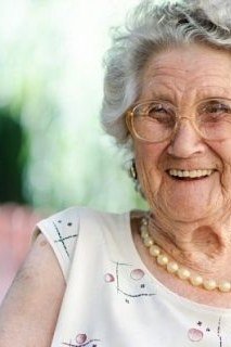 Gray Curly Bob with Gentle Waves on a woman over 70