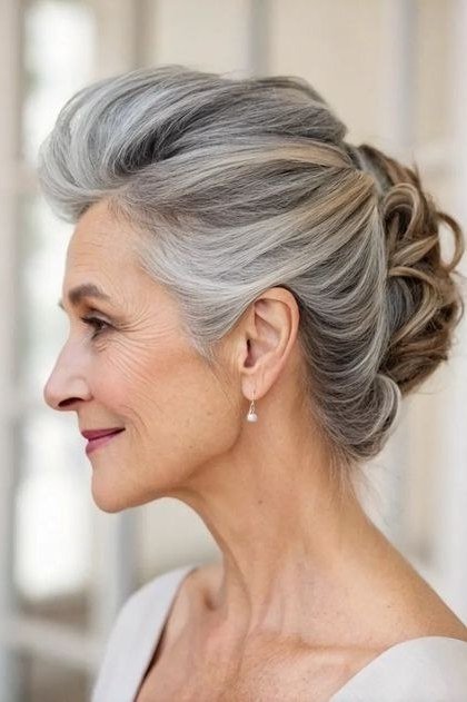 Elegant Low Bun with a Polished Feel on a woman over 70