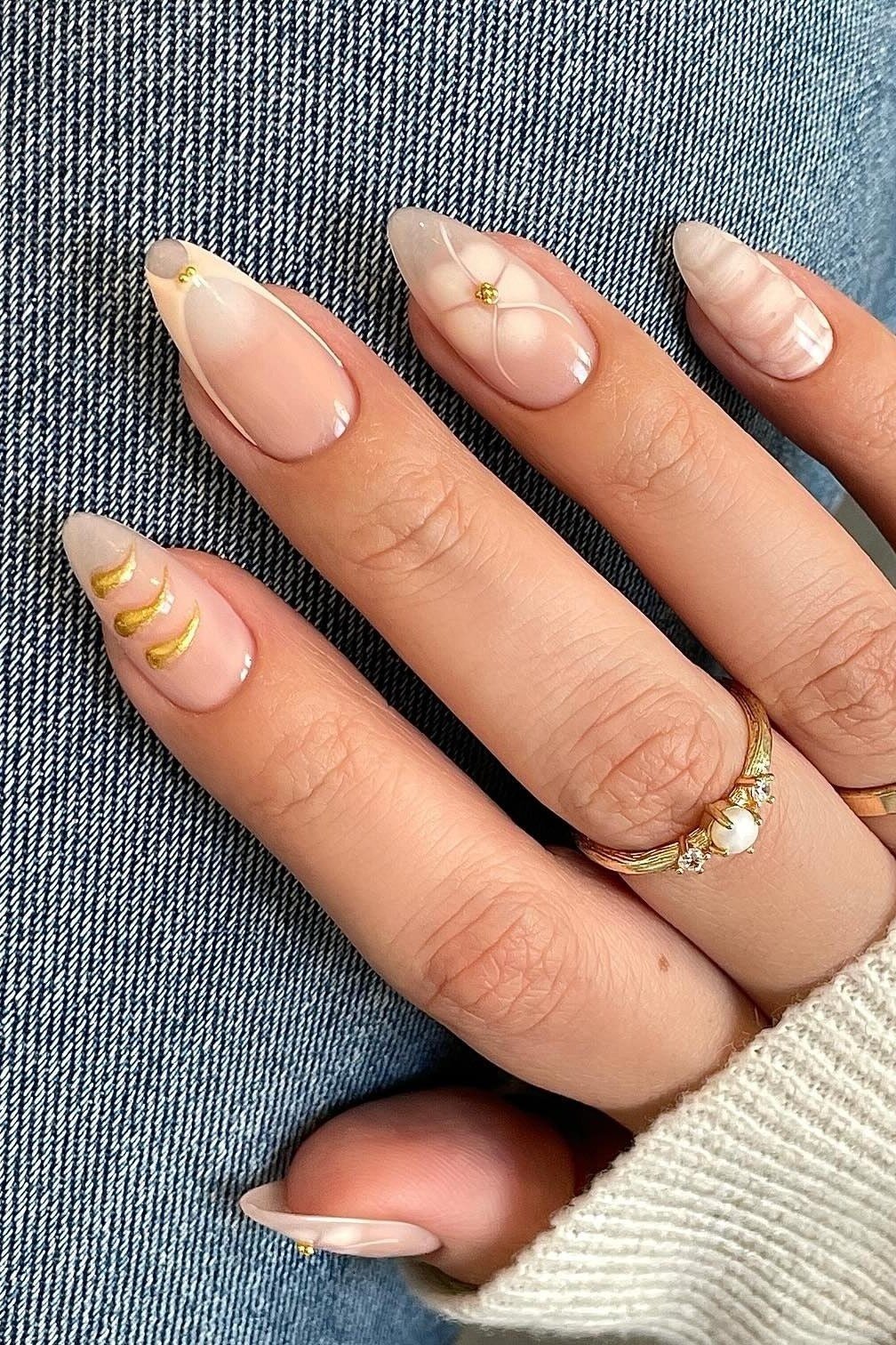 Nude Almond Nails with Thin Gold Line Details - simple nail design for women over 60