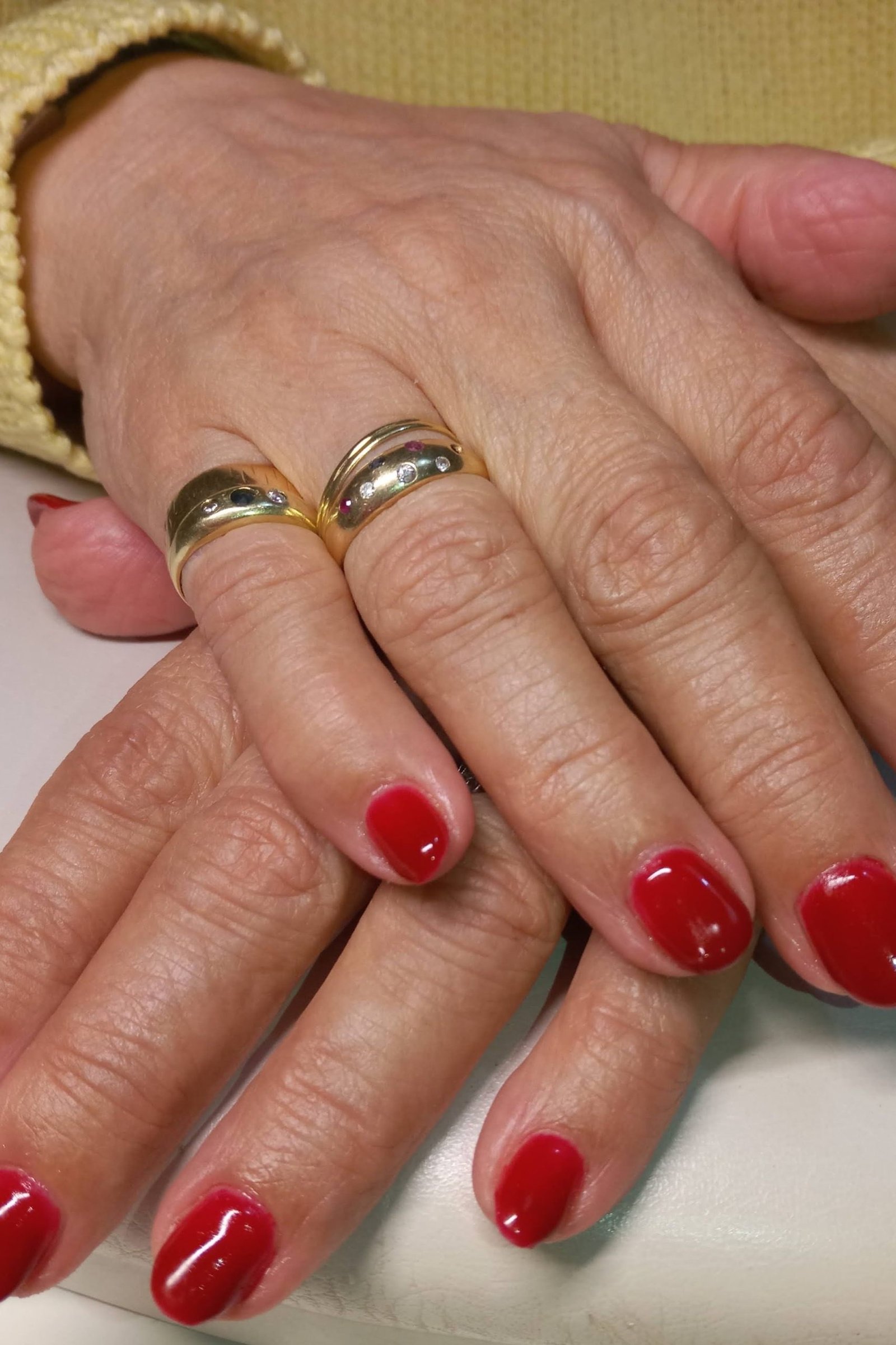 Glossy Red Nails with Gold Rings - simple nail design for women over 60