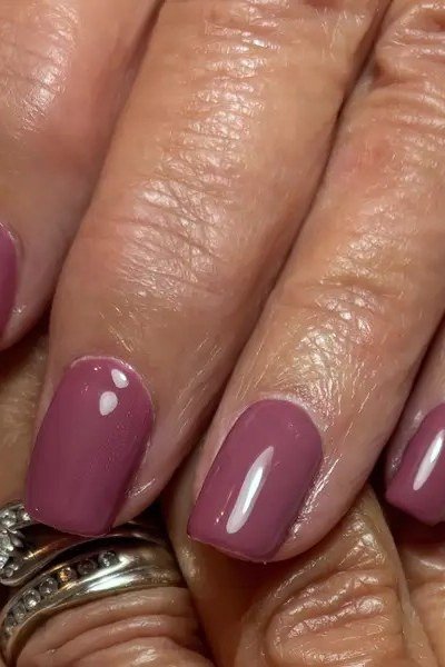 Glossy Berry Mauve Nails - simple nail design for women over 60