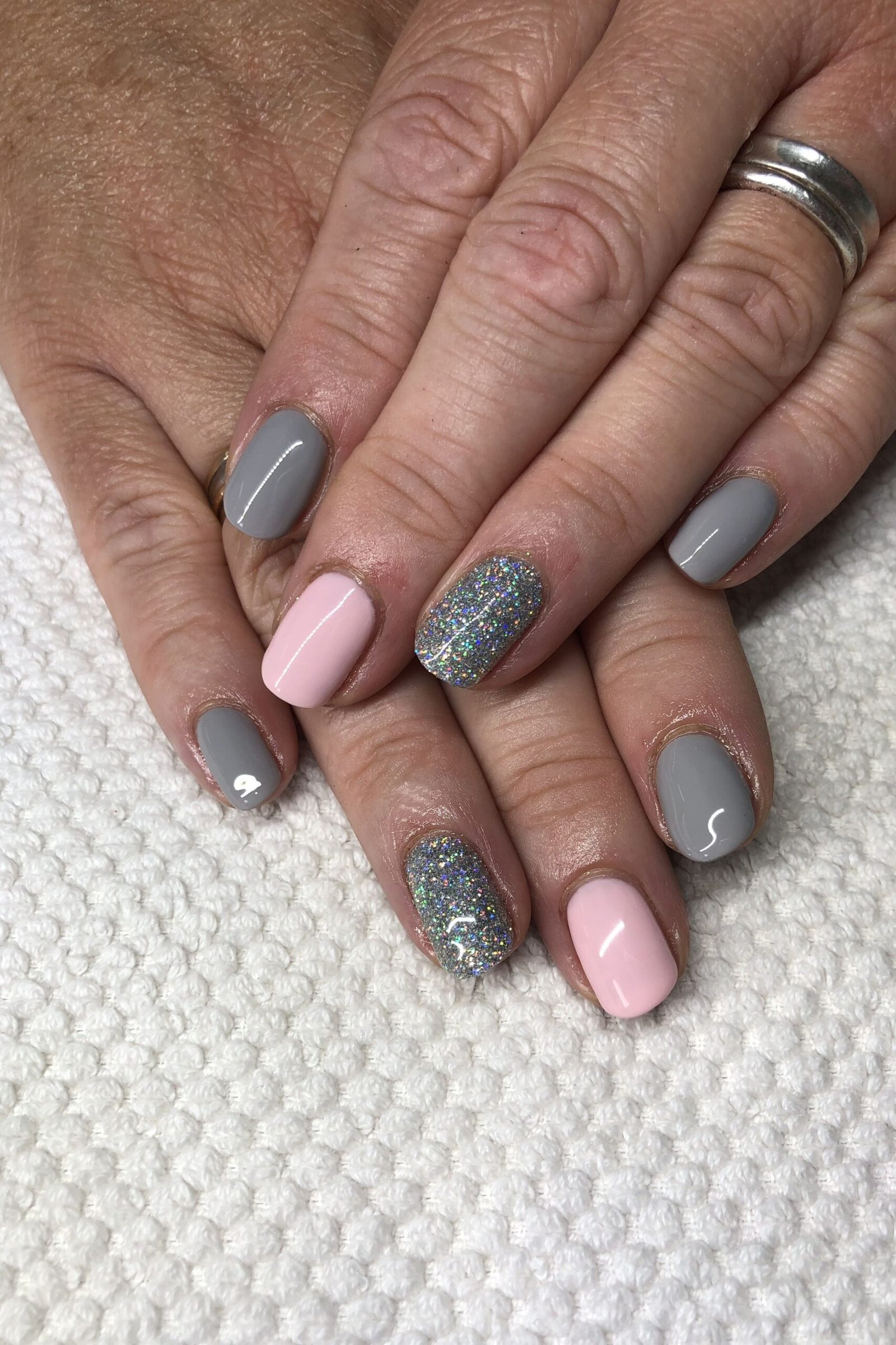 Grey Nails with Pink and Glitter Accents - simple nail design for women over 60