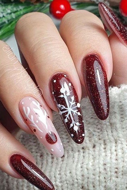 Burgundy and pink nails with white snowflake nail art, two-tone winter manicure
