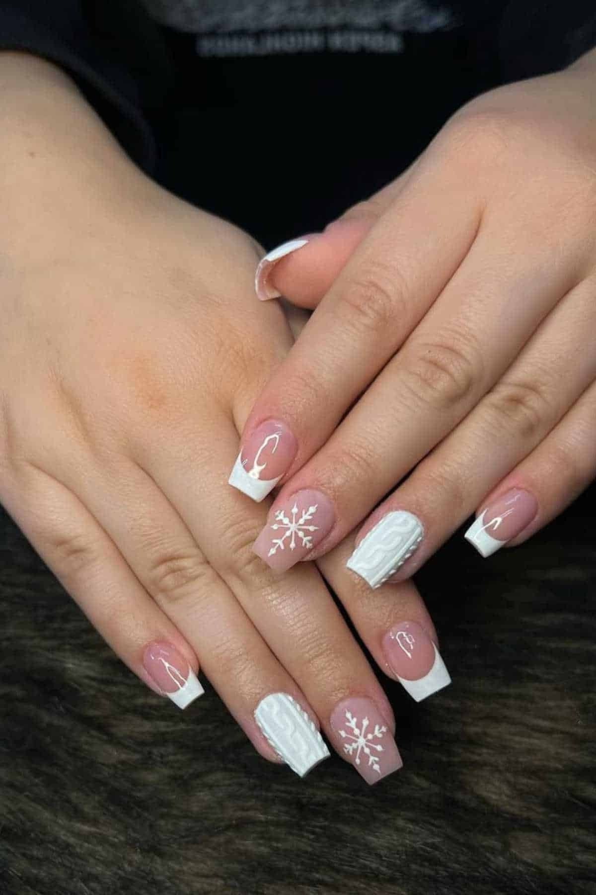 French tip nails with tiny snowflakes on white tips, classic winter manicure