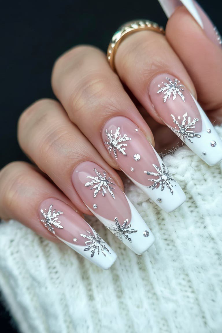 Sweet pink nails with crisp white snowflakes, fresh feminine winter manicure