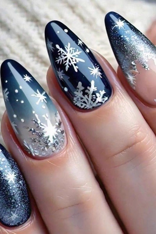 Navy glitter ombre nails with snowflakes, sparkling gradient winter nail art