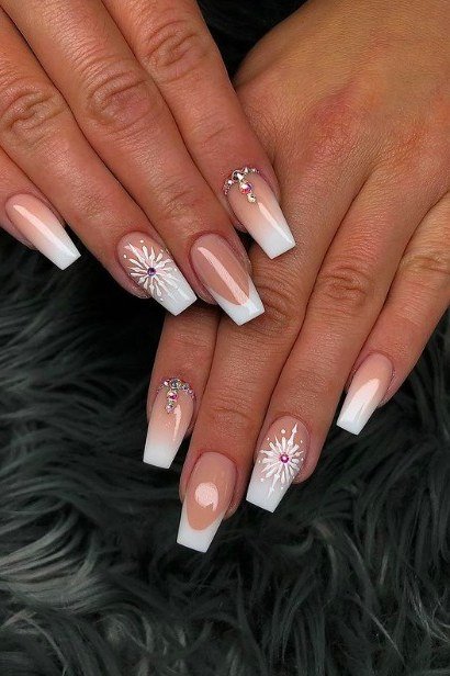Red ombre nails fading wine to cherry with white snowflakes, fiery winter nail art