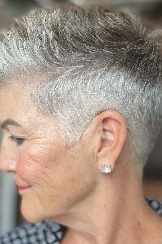 Neat short spiky silver pixie hairstyle for older women