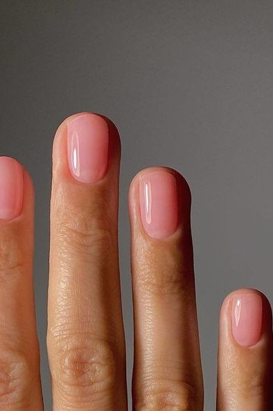 Sheer Pink Oval on Rich Skin - simple pink nail idea for women over 50