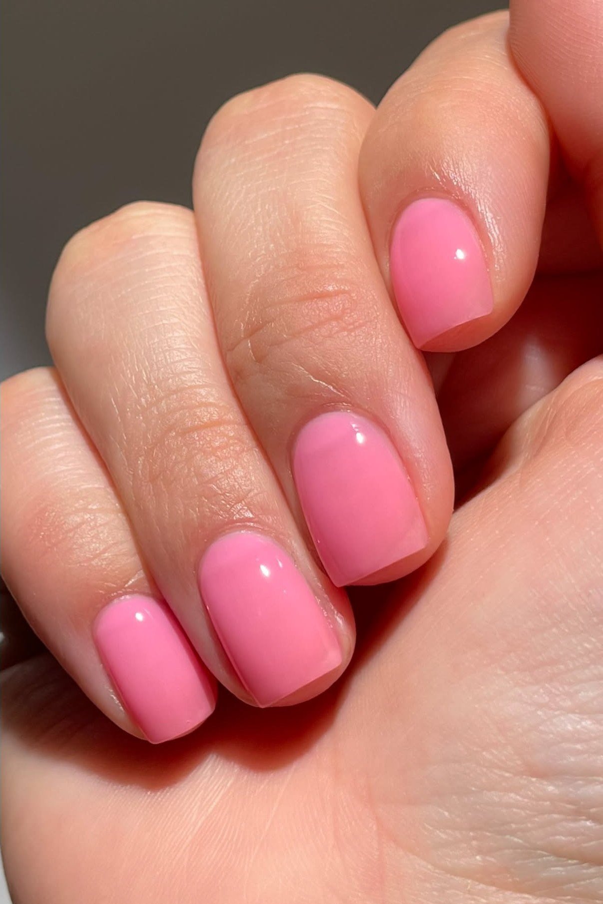 Bright Pink Short Ovals - simple pink nail idea for women over 50