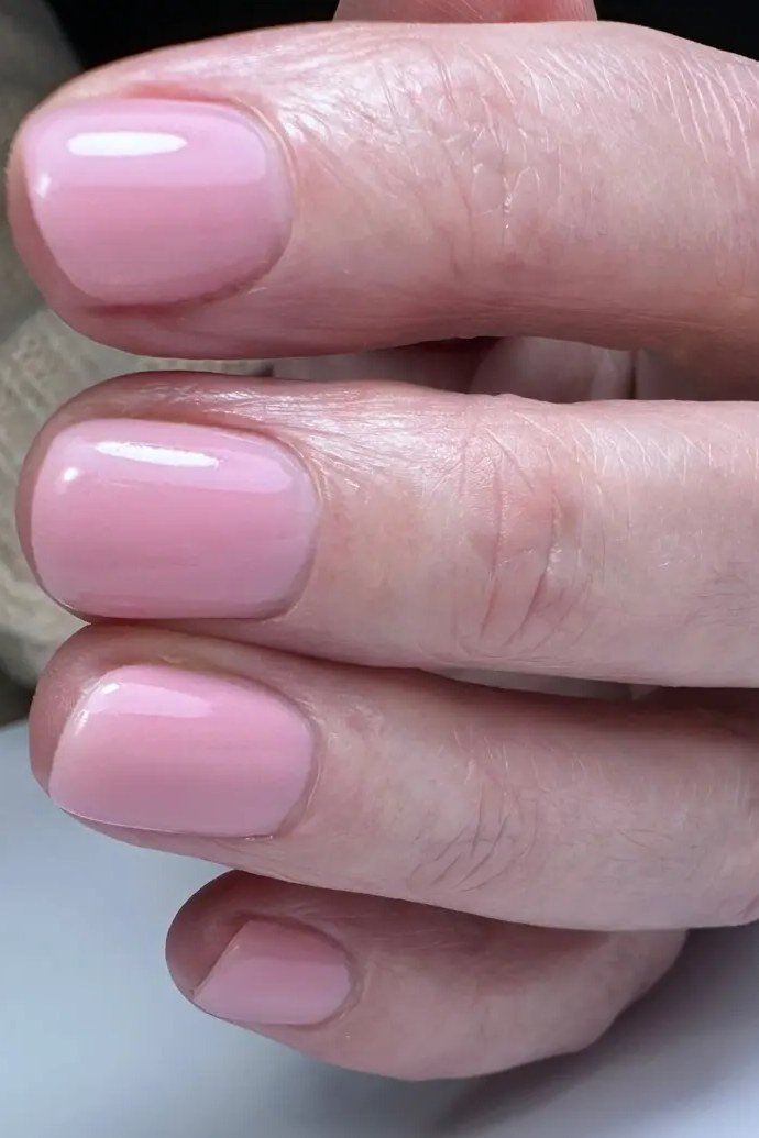 Soft Pink Oval Close-Up - simple pink nail idea for women over 50