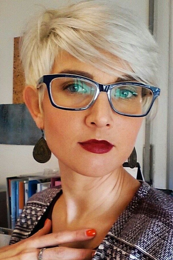 White Pixie with Bold Glasses - simple stylish hairstyle for women over 70 (white pixie with bold blue glasses, front view)