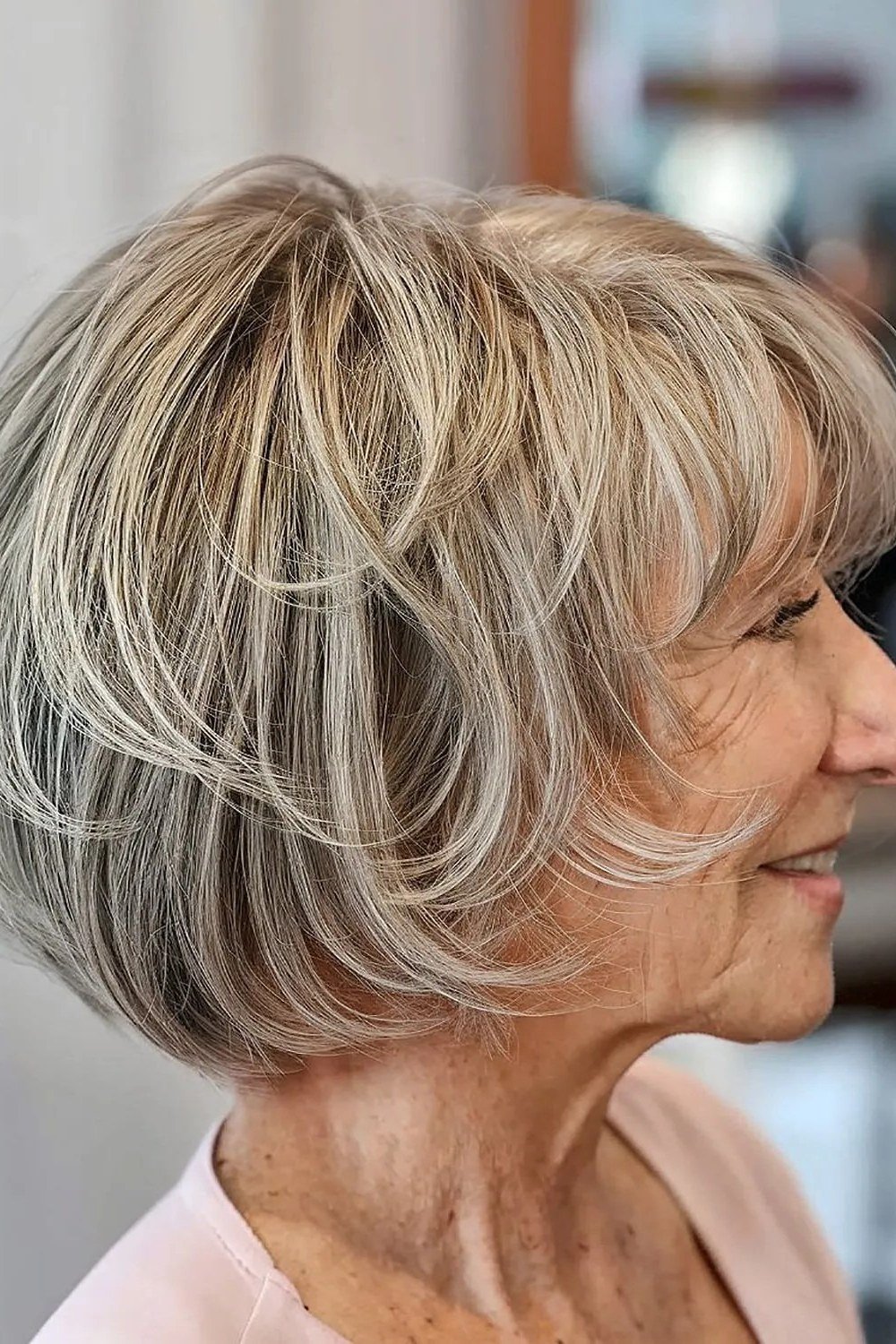 Blonde Feathered Bob - simple stylish hairstyle for women over 70 (blonde feathered bob, side view)