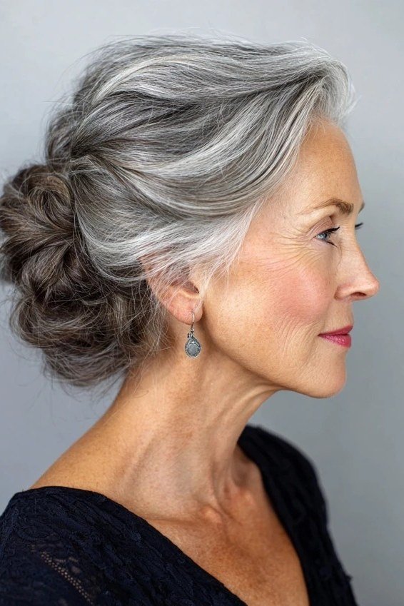 Grey Low Bun updo - simple stylish hairstyle for women over 70 (grey low bun updo, side view)