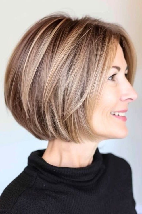 Dark ash blonde angled bob haircut for women over 60, side profile view