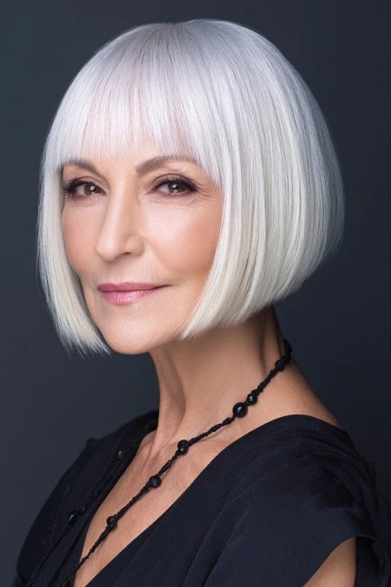 Platinum white sleek bob with bangs, necklace - inverted bob haircut for women over 60