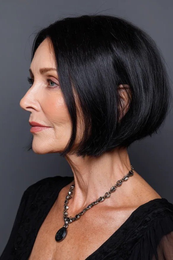 Jet-black sleek inverted bob, side, necklace - inverted bob haircut for women over 60