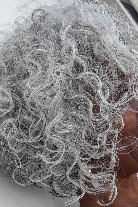 Curly grey bob, front-side, Black woman - inverted bob haircut for women over 60