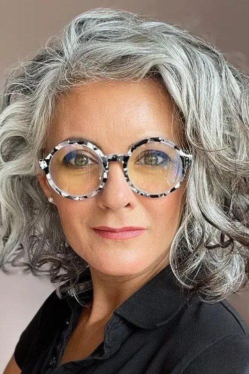Silver wavy bob with glasses, front - inverted bob haircut for women over 60