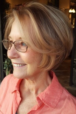 Blonde bob with glasses, coral shirt - inverted bob haircut for women over 60